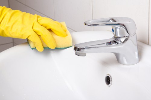 Technician cleaning a living room sofa in Wembley Park